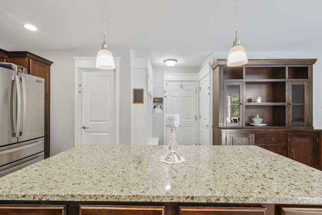 1127 Fillmore St, East Stroudsburg, PA 18301 - kitchen with freestanding refrigerator, a kitchen island, light stone countertops, hanging light fixtures, and recessed lighting