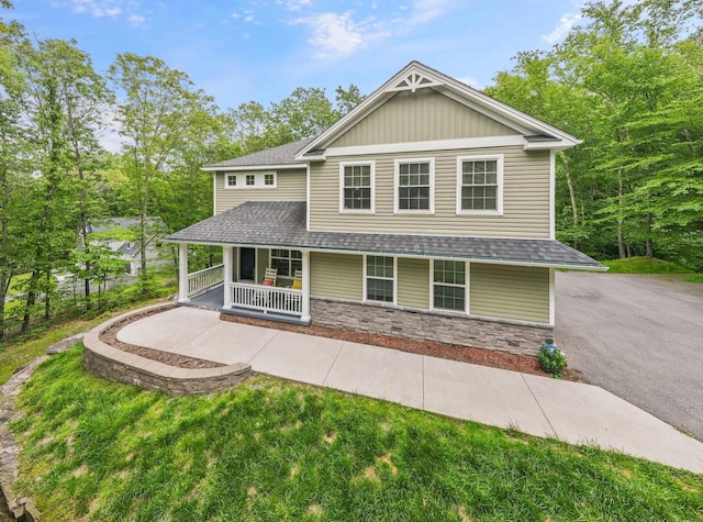 1127 Fillmore St, East Stroudsburg, PA 18301 - view of front of house with covered porch, stone siding, and a shingled roof