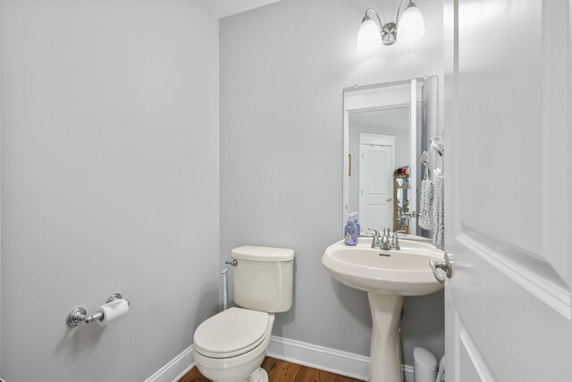1127 Fillmore St, East Stroudsburg, PA 18301 - bathroom with toilet and wood finished floors