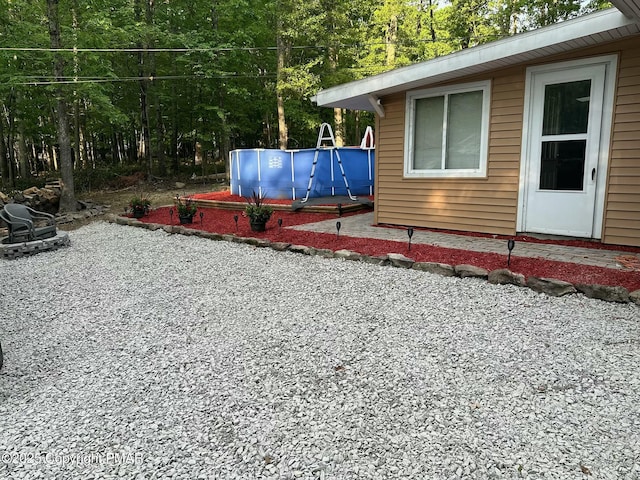 view of yard featuring an outdoor pool