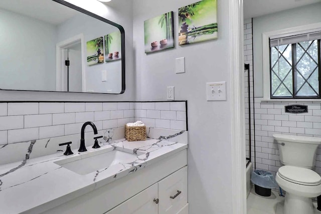 3360 Rte 940, Mount Pocono, PA 18344 - full bath featuring toilet, tile walls, tile patterned flooring, tasteful backsplash, and vanity