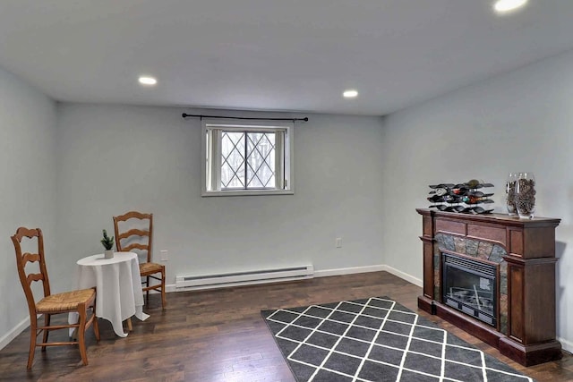 3360 Rte 940, Mount Pocono, PA 18344 - living area featuring wood finished floors, baseboards, a glass covered fireplace, a baseboard radiator, and recessed lighting