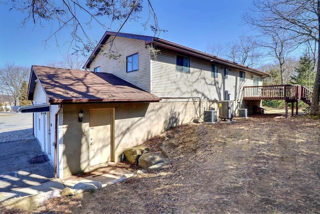 3360 Rte 940, Mount Pocono, PA 18344 - rear view of house featuring central air condition unit, roof with shingles, and a deck