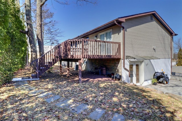 3360 Rte 940, Mount Pocono, PA 18344 - rear view of house featuring a wooden deck and stairs