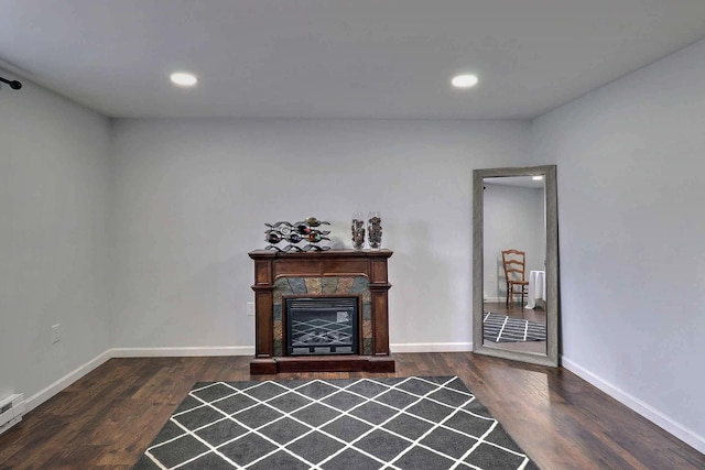 3360 Rte 940, Mount Pocono, PA 18344 - living area featuring dark wood-type flooring, recessed lighting, a baseboard radiator, baseboards, and a tiled fireplace