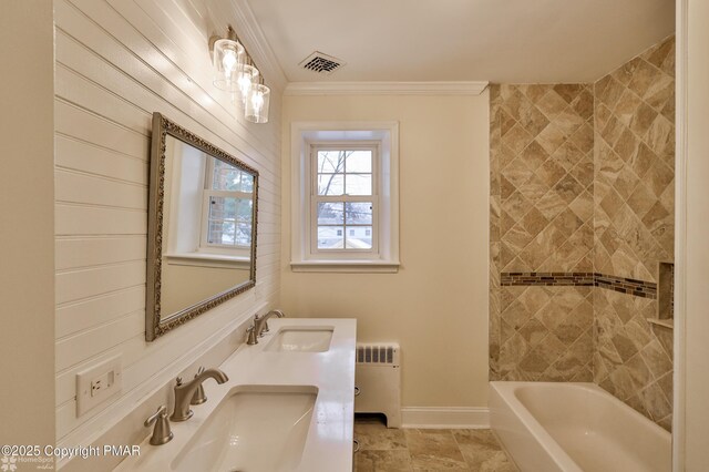 full bathroom with radiator, a sink, ornamental molding, and baseboards