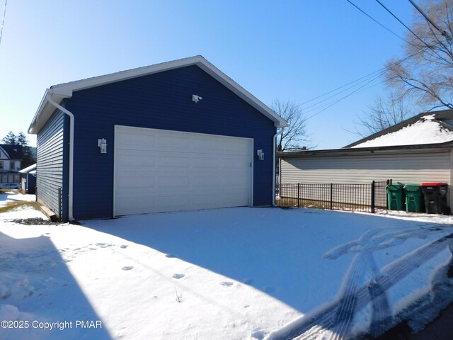 view of snow covered garage