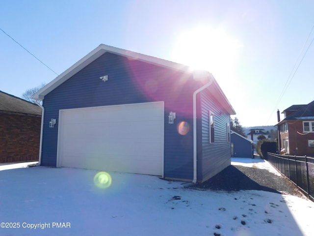 garage featuring fence