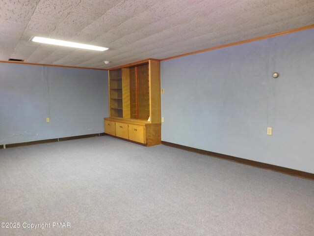 interior space with ornamental molding and built in features