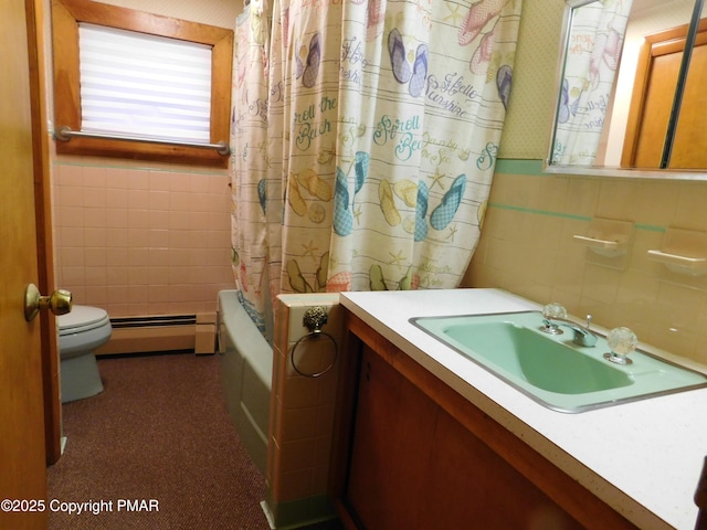 bathroom with toilet, a baseboard heating unit, tile walls, wallpapered walls, and vanity