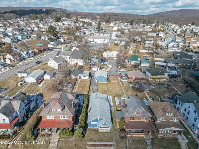 drone / aerial view featuring a mountain view