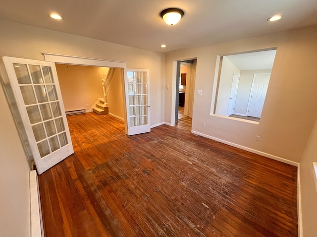 empty room with stairway, french doors, a baseboard radiator, baseboards, and baseboard heating