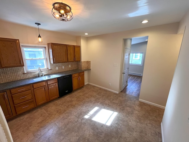 kitchen with brown cabinets, a sink, black dishwasher, dark countertops, and decorative backsplash