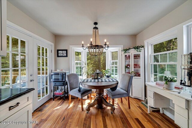 172 Steep Hill Rd, Cresco, PA 18326 - dining area with a chandelier, french doors, plenty of natural light, and light wood-type flooring
