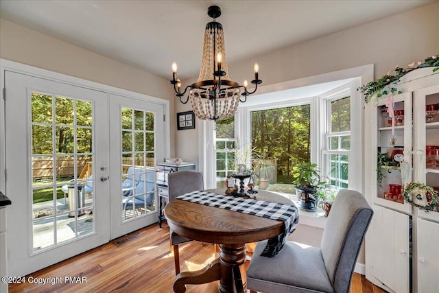 172 Steep Hill Rd, Cresco, PA 18326 - dining area with french doors, a chandelier, and light wood finished floors