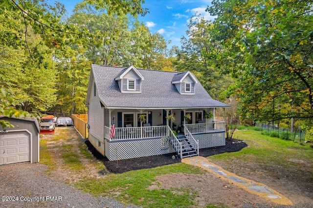 172 Steep Hill Rd, Cresco, PA 18326 - view of front facade with a porch, roof with shingles, driveway, and an outbuilding