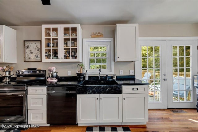 172 Steep Hill Rd, Cresco, PA 18326 - kitchen featuring stainless steel electric stove, dishwasher, white cabinets, dark countertops, and glass insert cabinets
