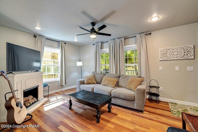 172 Steep Hill Rd, Cresco, PA 18326 - living area featuring ceiling fan, healthy amount of natural light, light wood-style flooring, a fireplace with raised hearth, and recessed lighting