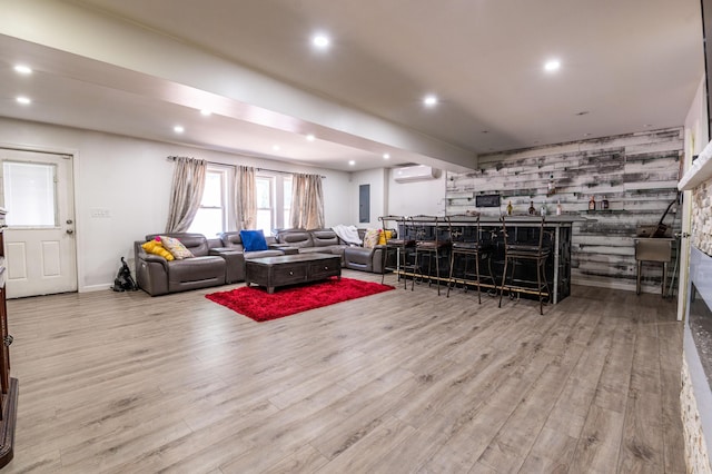 1555 Longleaf Dr, Effort, PA 18330 - living area featuring a wall mounted air conditioner, wood finished floors, recessed lighting, a bar, and an accent wall