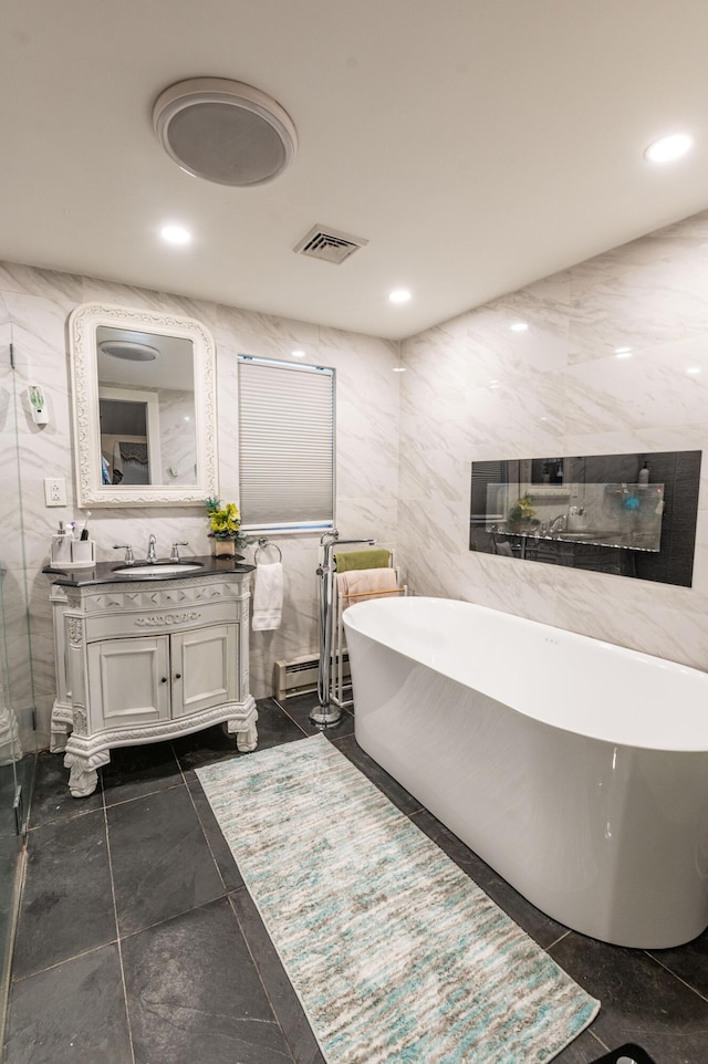 1555 Longleaf Dr, Effort, PA 18330 - bathroom with vanity, a freestanding tub, tile walls, and recessed lighting