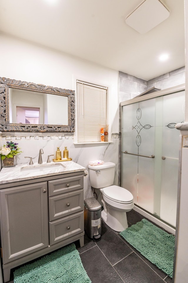 1555 Longleaf Dr, Effort, PA 18330 - bathroom with vanity, a shower stall, tile patterned flooring, and tile walls
