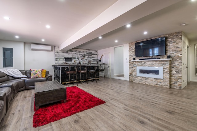 1555 Longleaf Dr, Effort, PA 18330 - living area with electric panel, bar, a wall unit AC, a fireplace, and wood finished floors