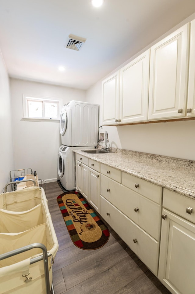 1555 Longleaf Dr, Effort, PA 18330 - laundry area with stacked washer / drying machine, cabinet space, dark wood-style flooring, and recessed lighting