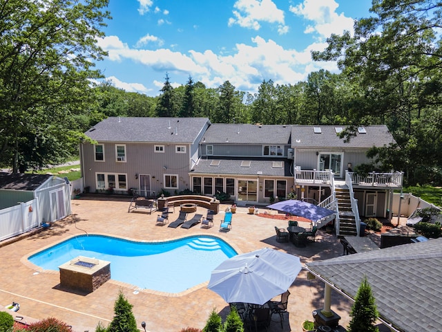 1555 Longleaf Dr, Effort, PA 18330 - swimming pool with a fire pit, a hot tub, a deck, and a patio area