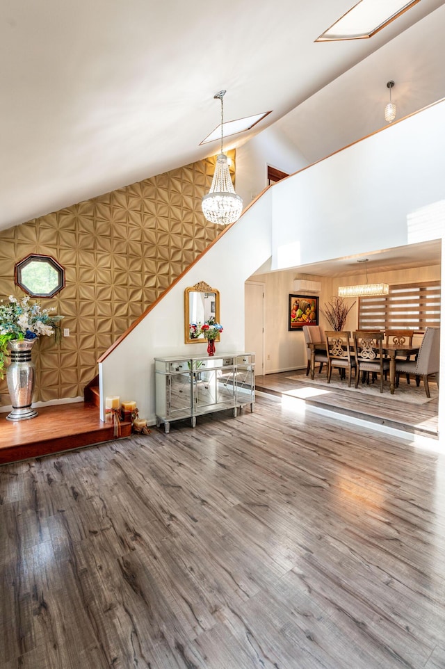 1555 Longleaf Dr, Effort, PA 18330 - living area featuring a chandelier, wood finished floors, and high vaulted ceiling