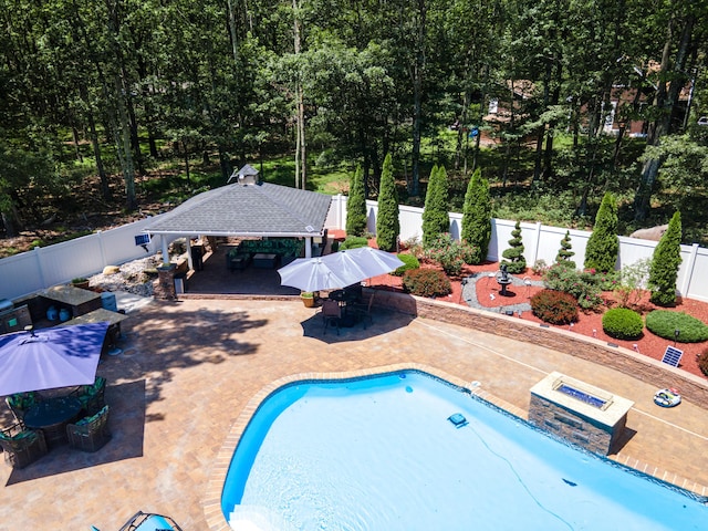 1555 Longleaf Dr, Effort, PA 18330 - view of swimming pool featuring a gazebo, a patio area, a fenced backyard, and outdoor dining area