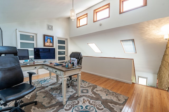 1555 Longleaf Dr, Effort, PA 18330 - home office with wood finished floors, plenty of natural light, and high vaulted ceiling