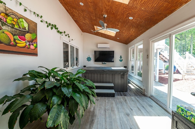 1555 Longleaf Dr, Effort, PA 18330 - sunroom / solarium with a jacuzzi, a skylight, wood finished floors, a wall mounted AC, and wood ceiling