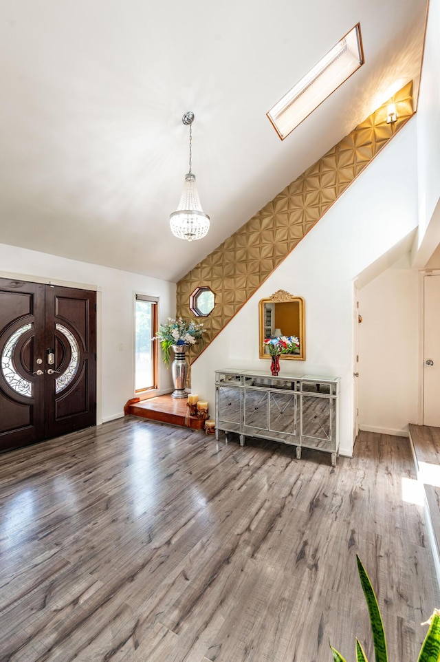 1555 Longleaf Dr, Effort, PA 18330 - foyer featuring wood finished floors, lofted ceiling, a chandelier, and french doors