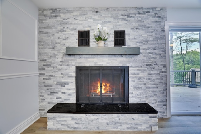 3109 Snowden Dr, Bushkill, PA 18324 - detailed view of wood finished floors and a lit fireplace