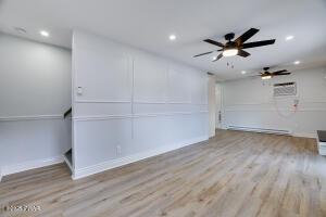 3109 Snowden Dr, Bushkill, PA 18324 - spare room with wood finished floors, recessed lighting, a ceiling fan, and a wall mounted air conditioner