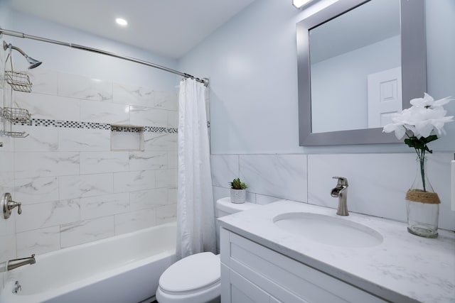 3109 Snowden Dr, Bushkill, PA 18324 - bathroom featuring shower / bath combo, vanity, and tile walls