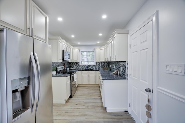 3109 Snowden Dr, Bushkill, PA 18324 - kitchen featuring stainless steel appliances, backsplash, light wood finished floors, recessed lighting, and white cabinetry