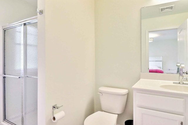 301 Reagan Dr, East Stroudsburg, PA 18301 - bathroom with toilet, visible vents, a shower stall, and vanity