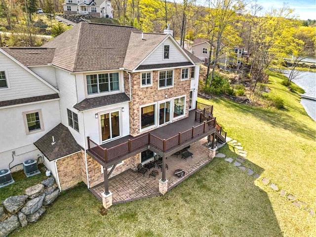 301 Reagan Dr, East Stroudsburg, PA 18301 - rear view of property with a yard, a deck, a shingled roof, and a patio