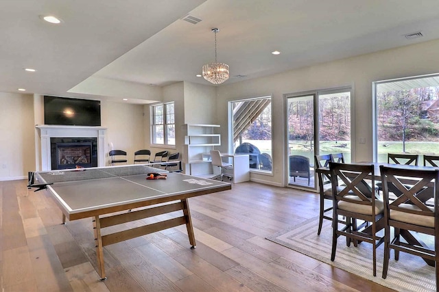 301 Reagan Dr, East Stroudsburg, PA 18301 - game room with a glass covered fireplace, recessed lighting, hardwood / wood-style floors, and visible vents