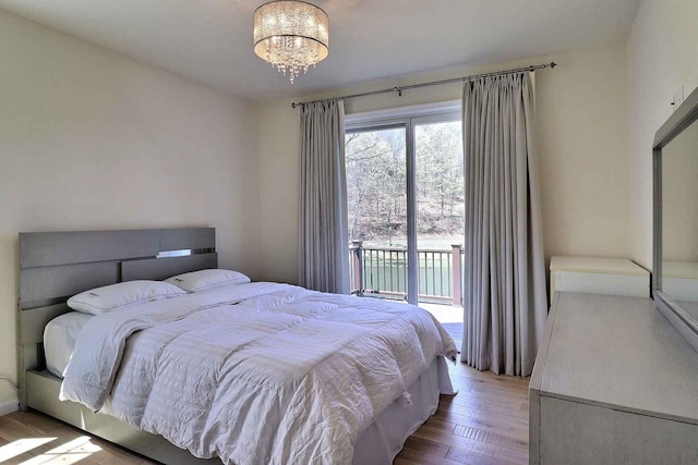 301 Reagan Dr, East Stroudsburg, PA 18301 - bedroom featuring access to outside, a chandelier, and wood finished floors