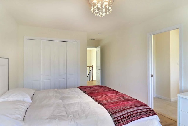301 Reagan Dr, East Stroudsburg, PA 18301 - bedroom featuring a closet, baseboards, visible vents, and an inviting chandelier