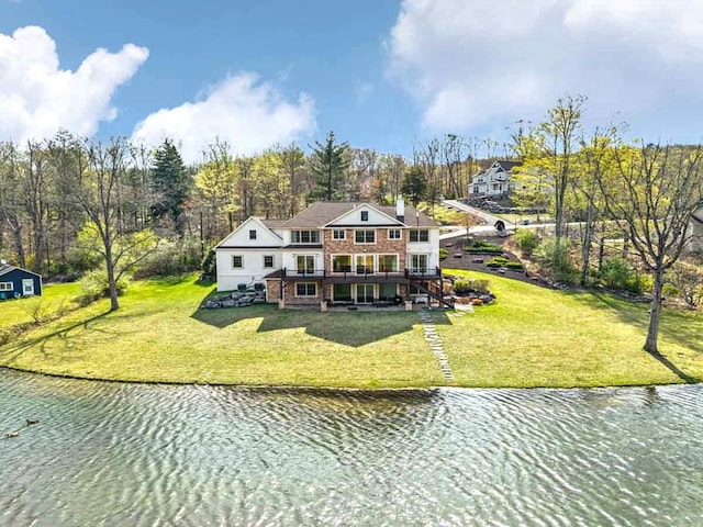 301 Reagan Dr, East Stroudsburg, PA 18301 - back of house with a deck with water view, a yard, and stairway