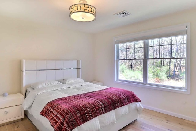 301 Reagan Dr, East Stroudsburg, PA 18301 - bedroom with baseboards, light wood finished floors, and visible vents