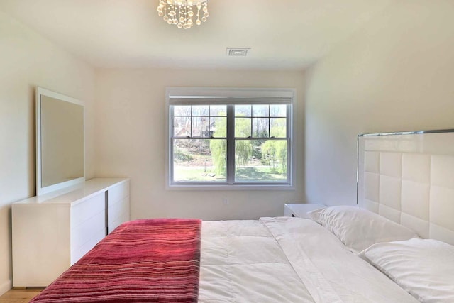 301 Reagan Dr, East Stroudsburg, PA 18301 - bedroom featuring a notable chandelier and visible vents