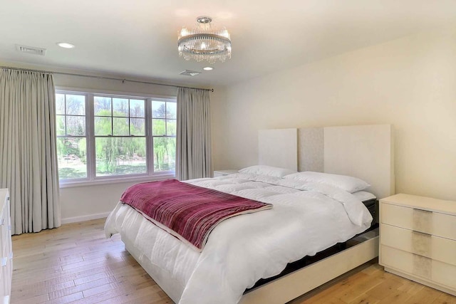 301 Reagan Dr, East Stroudsburg, PA 18301 - bedroom with visible vents, baseboards, a chandelier, recessed lighting, and light wood-style flooring