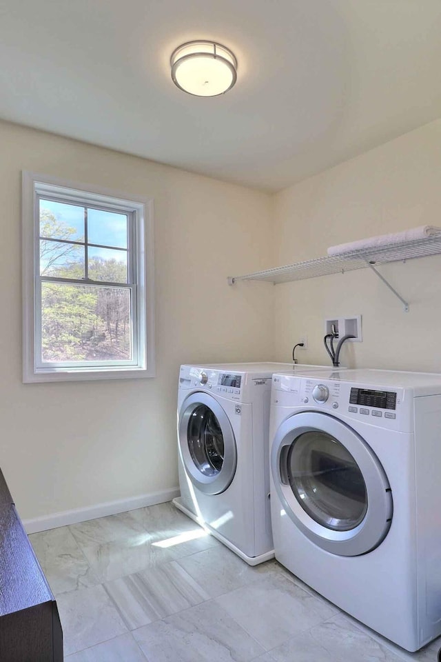 301 Reagan Dr, East Stroudsburg, PA 18301 - washroom featuring baseboards, laundry area, washing machine and dryer, and marble finish floor
