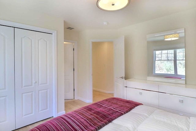 301 Reagan Dr, East Stroudsburg, PA 18301 - bedroom with baseboards, visible vents, light wood finished floors, and a closet