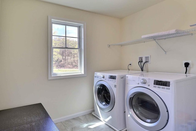 301 Reagan Dr, East Stroudsburg, PA 18301 - laundry room featuring independent washer and dryer, laundry area, baseboards, and marble finish floor