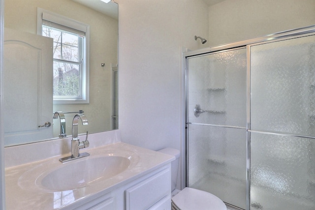 301 Reagan Dr, East Stroudsburg, PA 18301 - full bathroom with vanity, a stall shower, and toilet